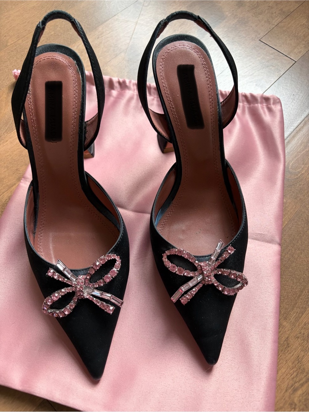 Black satin sling back pump with pink bow accent